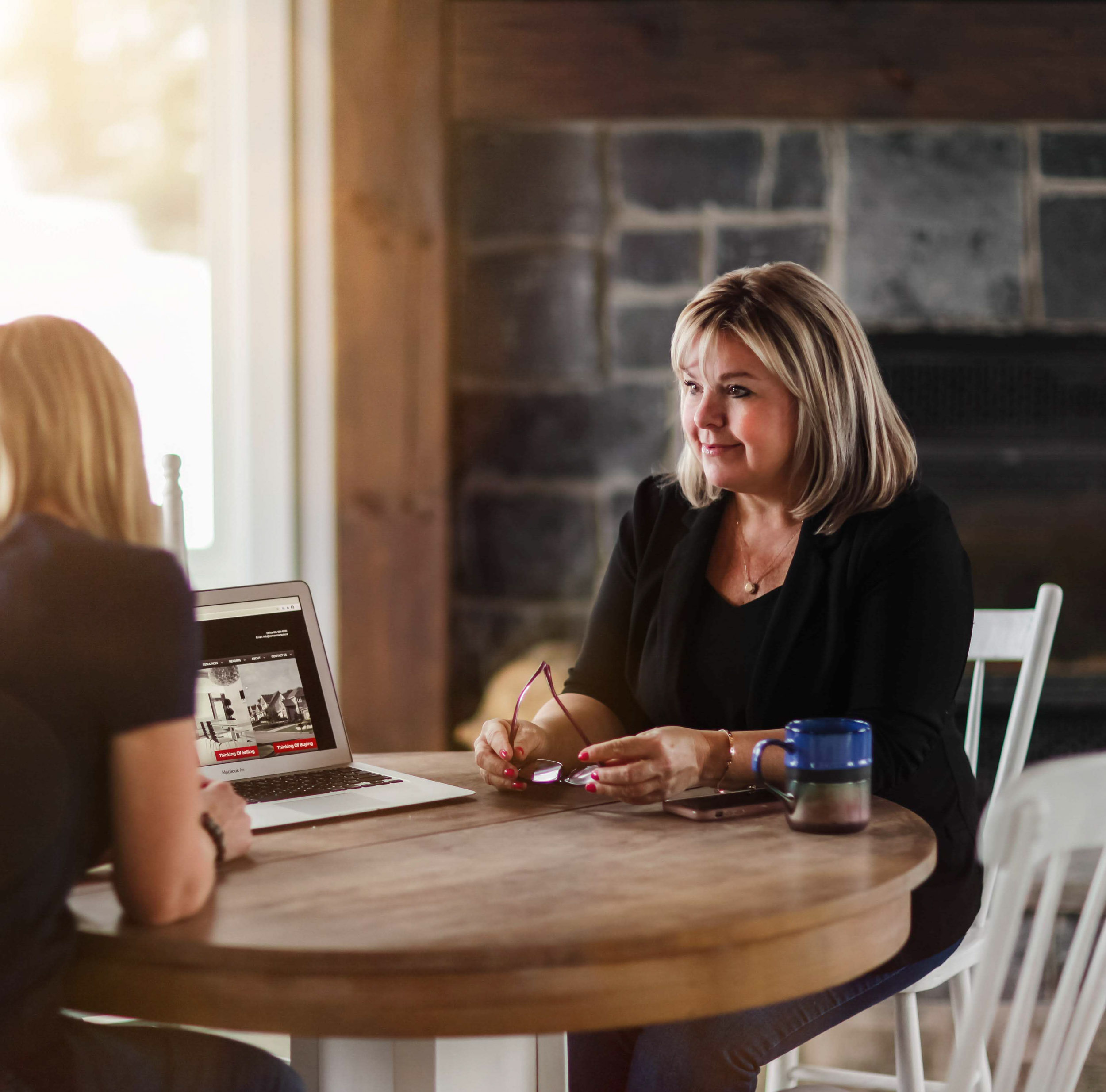 Tanya Flaro sitting with woman at table